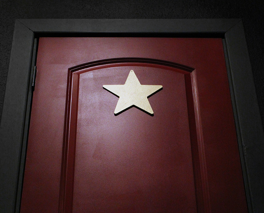 Photo of a red door with a gold star