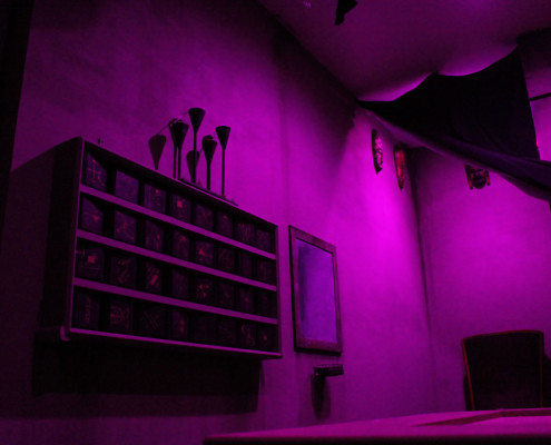 Photo of a shadowy room in purple light