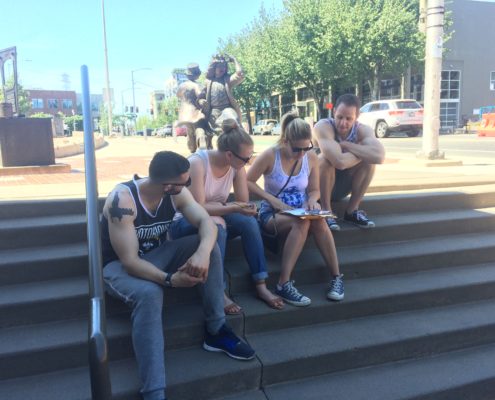 Photo of players sitting on steps outside